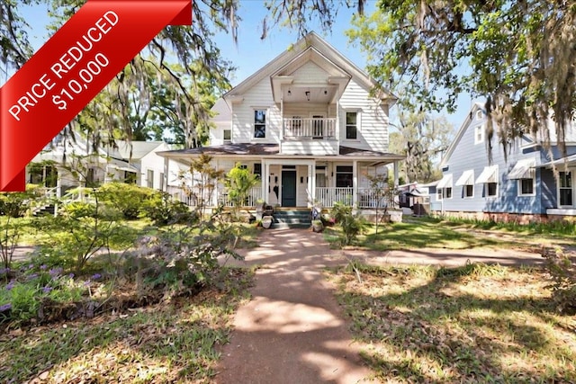 230 E Washington St, Quincy, FL 32351 - view of front facade with a porch and a balcony