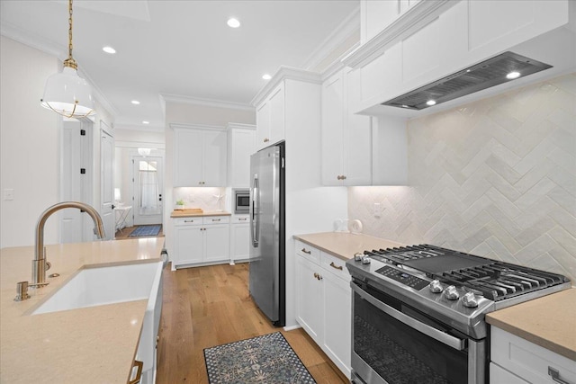 190 Camellia Oaks Ave Unit 96, Tallahassee, FL 32317 - kitchen with appliances with stainless steel finishes, light countertops, white cabinetry, backsplash, and recessed lighting