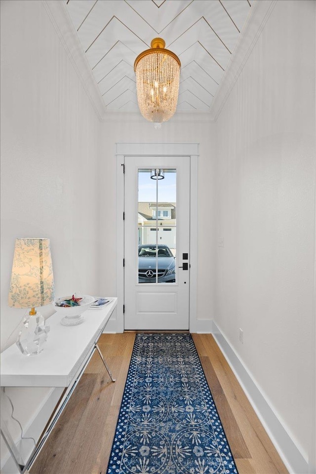 190 Camellia Oaks Ave Unit 96, Tallahassee, FL 32317 - doorway to outside featuring a chandelier, light wood-style floors, and ornamental molding