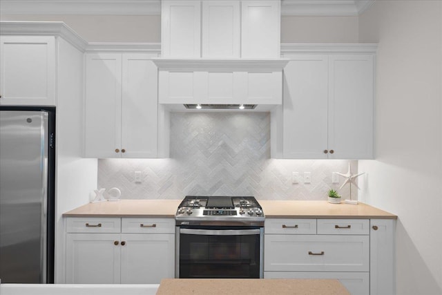 190 Camellia Oaks Ave Unit 96, Tallahassee, FL 32317 - kitchen with appliances with stainless steel finishes, white cabinets, light countertops, tasteful backsplash, and ornamental molding