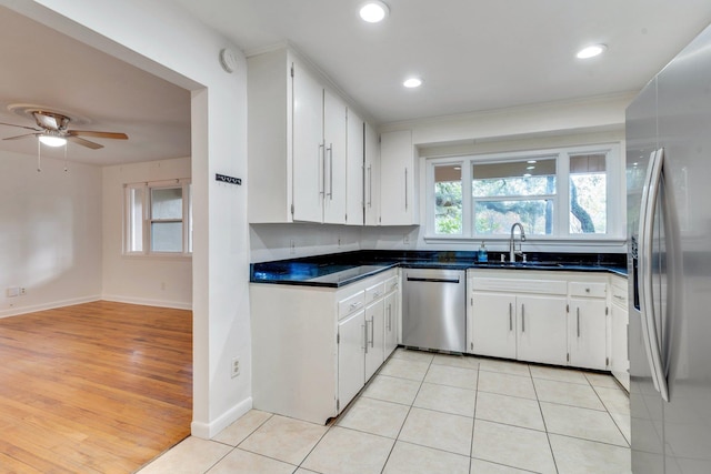 kitchen featuring sink, white cabinetry, and stainless steel appliances