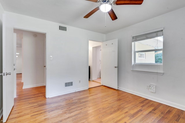 unfurnished bedroom with ceiling fan and light hardwood / wood-style floors