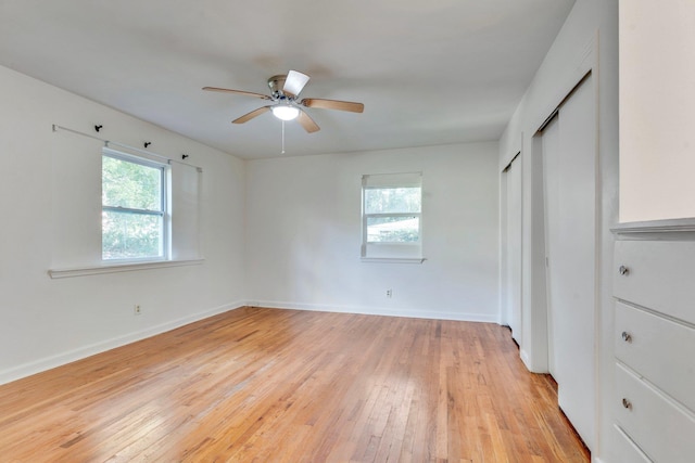 unfurnished bedroom with ceiling fan and light wood-type flooring