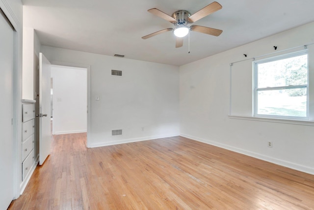 spare room with ceiling fan and light hardwood / wood-style flooring