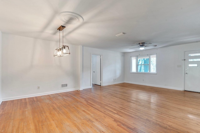 unfurnished room featuring ceiling fan and light hardwood / wood-style floors