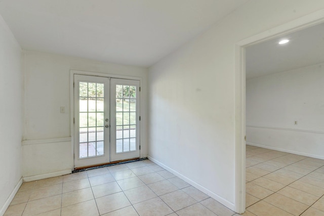 doorway featuring french doors and light tile patterned flooring