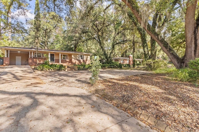 single story home with a carport