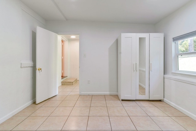 unfurnished bedroom featuring light tile patterned floors