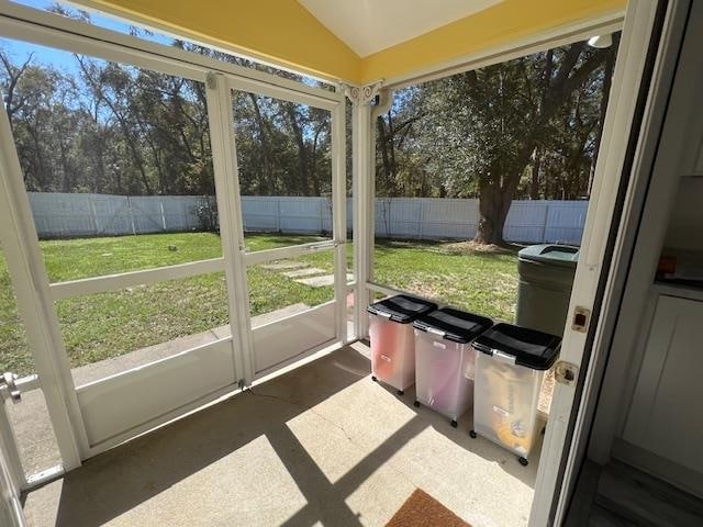 sunroom / solarium with lofted ceiling