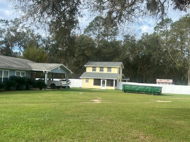 view of yard featuring a carport