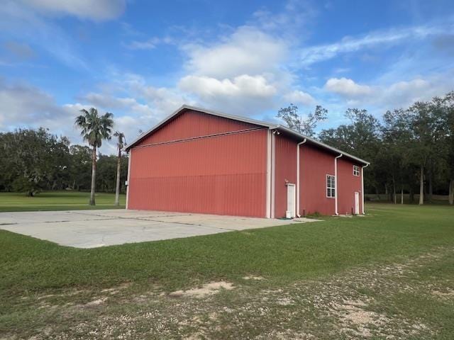 view of property exterior featuring a lawn