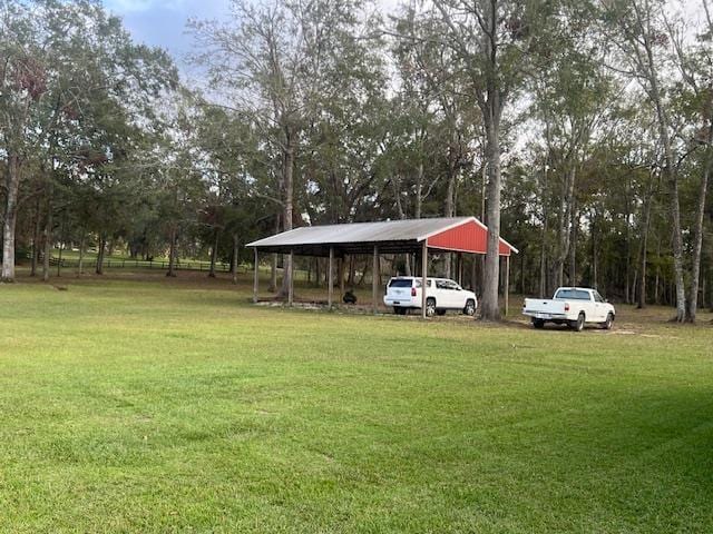 view of yard with a carport