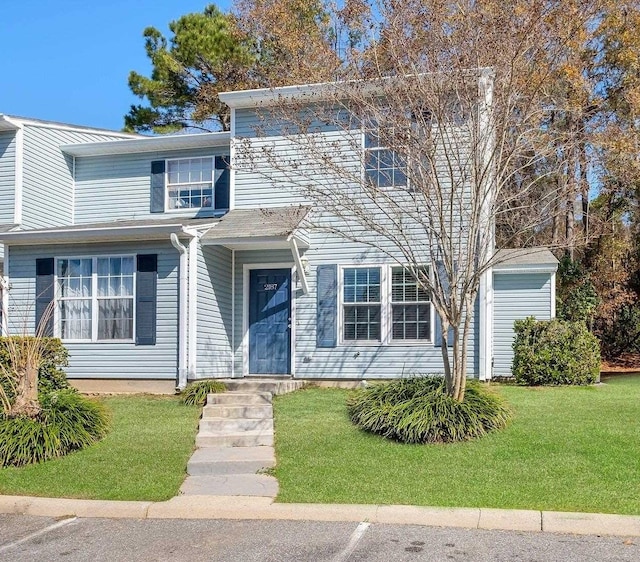 view of property with a front lawn