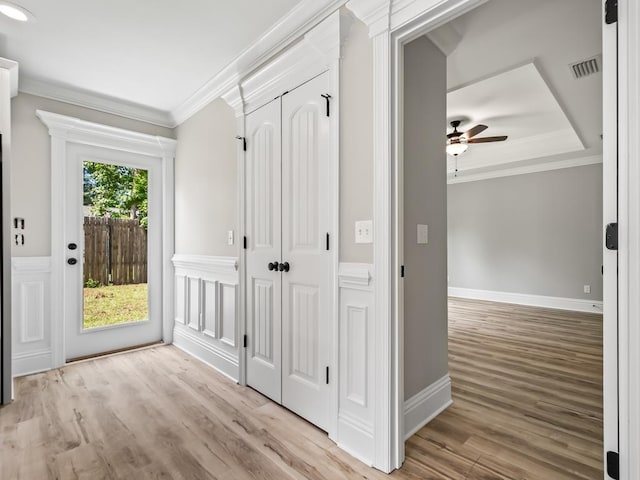 mudroom with ornamental molding, light hardwood / wood-style floors, and ceiling fan