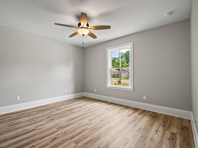 spare room featuring ceiling fan and light hardwood / wood-style floors