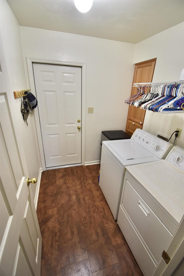 2736 Oakleigh Ct, Tallahassee, FL 32312 - washroom featuring washing machine and dryer, dark wood-style floors, and baseboards