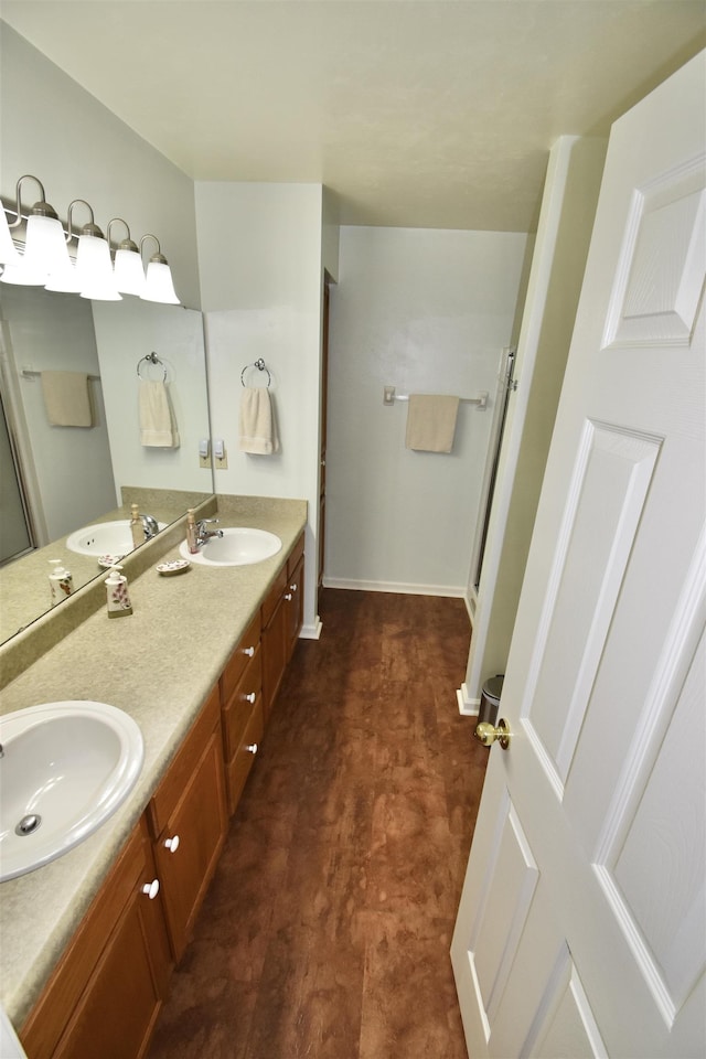2736 Oakleigh Ct, Tallahassee, FL 32312 - full bathroom with tile patterned floors, a shower stall, double vanity, and baseboards