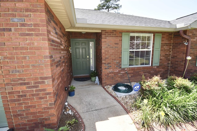 2736 Oakleigh Ct, Tallahassee, FL 32312 - view of exterior entry with roof with shingles and brick siding