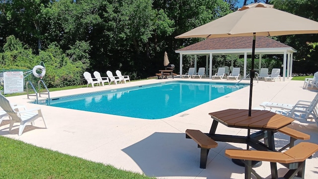 2736 Oakleigh Ct, Tallahassee, FL 32312 - community pool with a gazebo, a patio, and view of wooded area