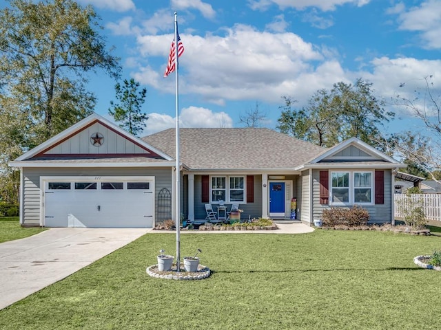 ranch-style home featuring a front yard and a garage