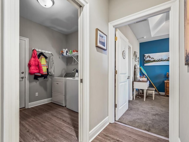 clothes washing area featuring independent washer and dryer and dark hardwood / wood-style floors