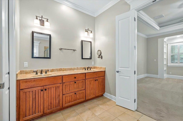full bath with crown molding, double vanity, baseboards, and tile patterned floors