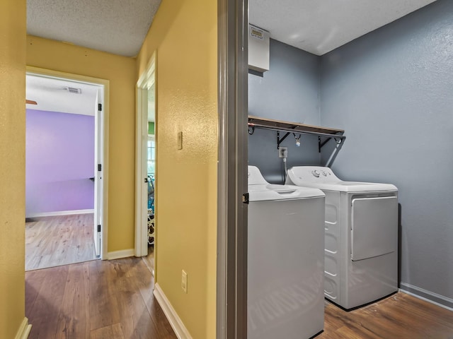 51 Mulberry Cir, Crawfordville, FL 32327 - washroom with wood finished floors and washer and clothes dryer
