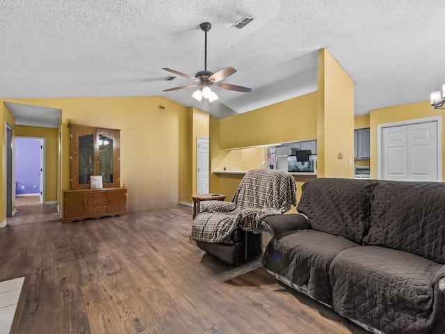 51 Mulberry Cir, Crawfordville, FL 32327 - living area featuring wood finished floors, vaulted ceiling, a ceiling fan, and a textured ceiling