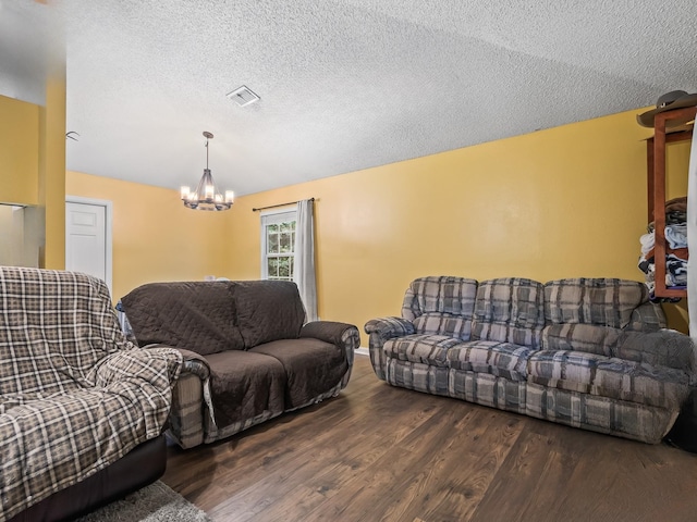51 Mulberry Cir, Crawfordville, FL 32327 - living area featuring a chandelier, wood finished floors, and a textured ceiling