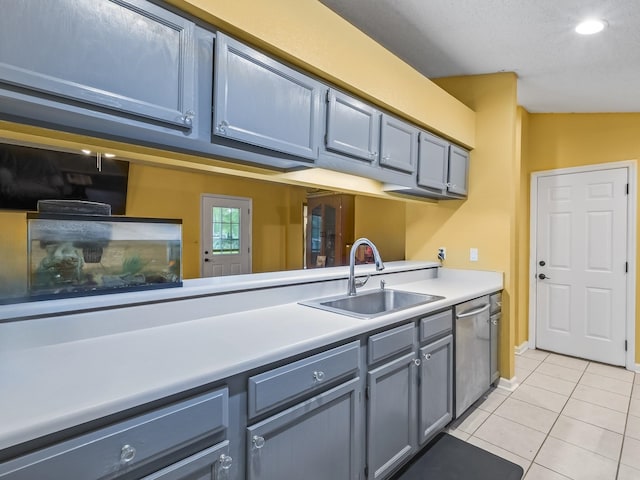 51 Mulberry Cir, Crawfordville, FL 32327 - kitchen featuring light tile patterned floors, dishwasher, light countertops, gray cabinets, and recessed lighting
