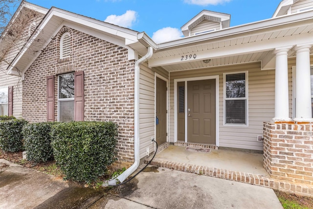 doorway to property with a porch