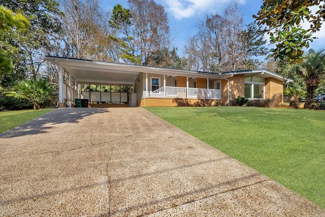 single story home featuring a carport, covered porch, and a front lawn