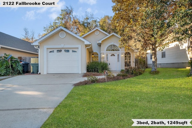 single story home with an attached garage, stucco siding, concrete driveway, and a front yard