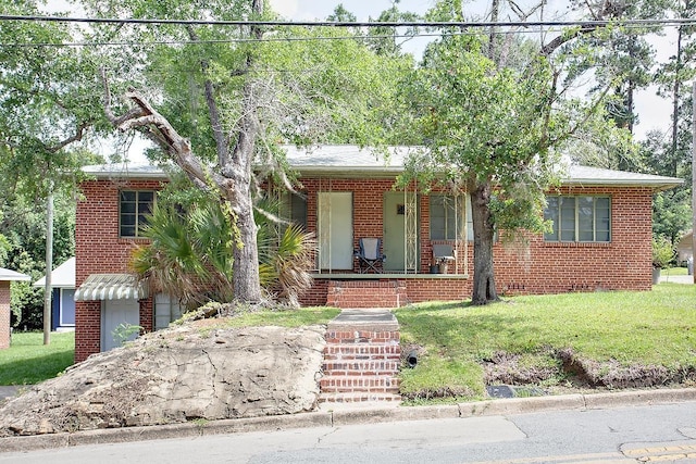 316-328 E Pershing St Unit 316-328, Tallahassee, FL 32301 - view of front of house with a front yard and a porch