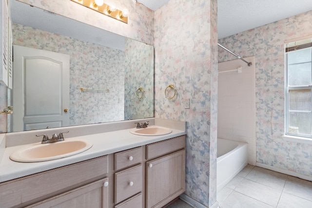 8827 Sapphire Dr, Tallahassee, FL 32309 - bathroom with baseboards, healthy amount of natural light, tile patterned floors, double vanity, and wallpapered walls