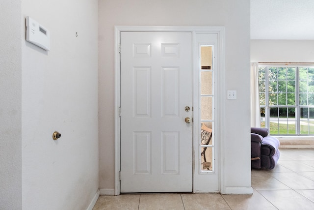 8827 Sapphire Dr, Tallahassee, FL 32309 - foyer entrance featuring light tile patterned floors and baseboards