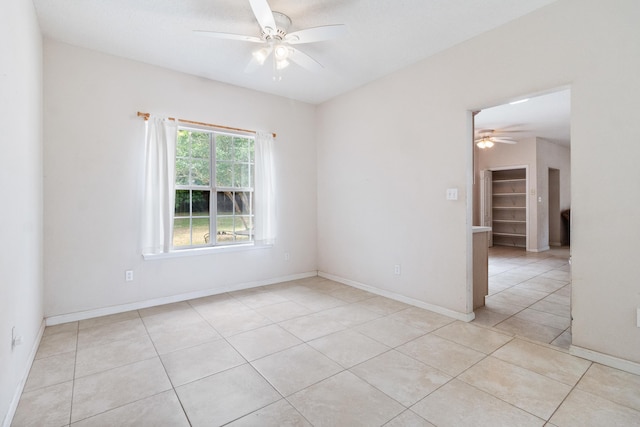 8827 Sapphire Dr, Tallahassee, FL 32309 - spare room with a ceiling fan and light tile patterned floors