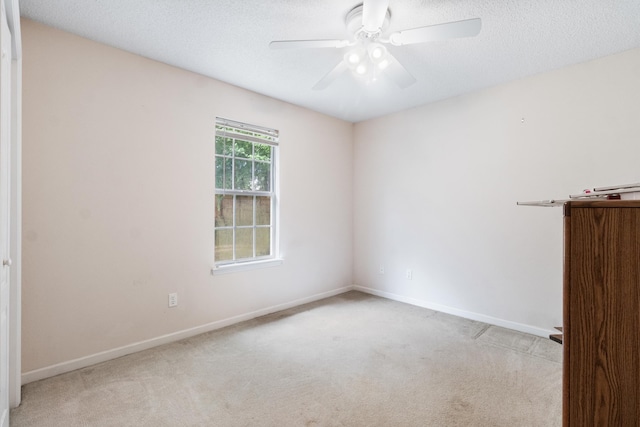 8827 Sapphire Dr, Tallahassee, FL 32309 - empty room with carpet floors, ceiling fan, baseboards, and a textured ceiling