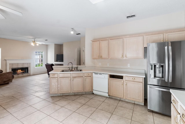 8827 Sapphire Dr, Tallahassee, FL 32309 - kitchen with stainless steel refrigerator with ice dispenser, white dishwasher, a sink, a ceiling fan, and light brown cabinets