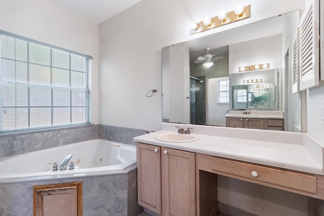 8827 Sapphire Dr, Tallahassee, FL 32309 - bathroom featuring a stall shower, a jetted tub, vanity, and a ceiling fan