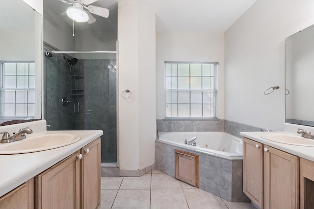 8827 Sapphire Dr, Tallahassee, FL 32309 - bathroom with a stall shower, a whirlpool tub, two vanities, and a ceiling fan
