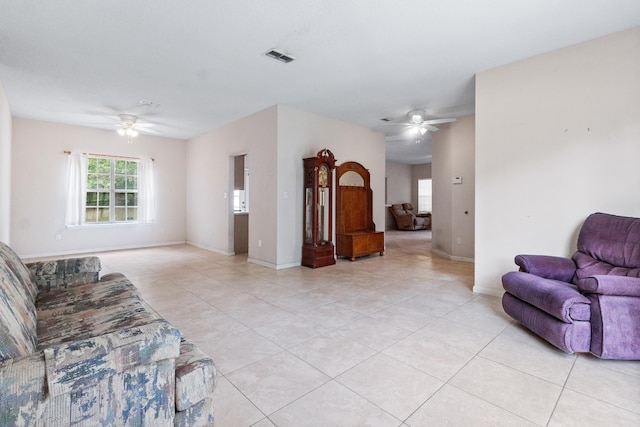 8827 Sapphire Dr, Tallahassee, FL 32309 - living room with a ceiling fan, light tile patterned floors, and baseboards