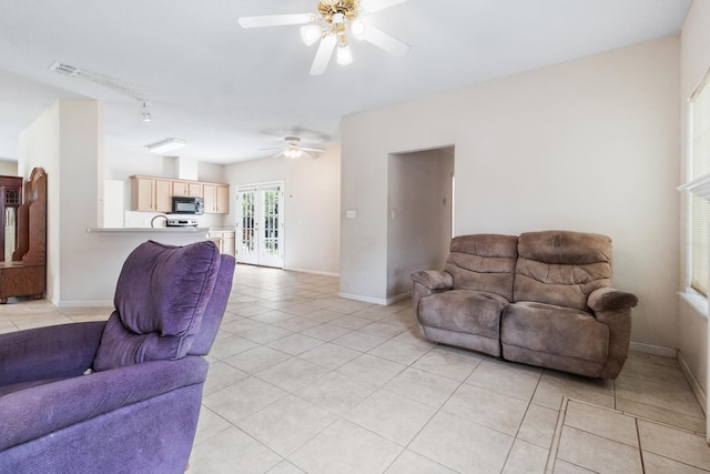 8827 Sapphire Dr, Tallahassee, FL 32309 - living area featuring a ceiling fan, light tile patterned floors, baseboards, and track lighting