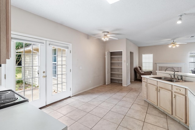 8827 Sapphire Dr, Tallahassee, FL 32309 - kitchen featuring a ceiling fan, a sink, french doors, open floor plan, and a textured ceiling
