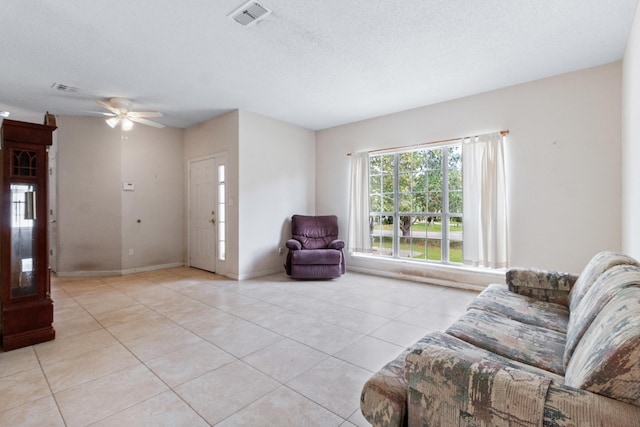 8827 Sapphire Dr, Tallahassee, FL 32309 - living area with light tile patterned flooring, ceiling fan, and baseboards