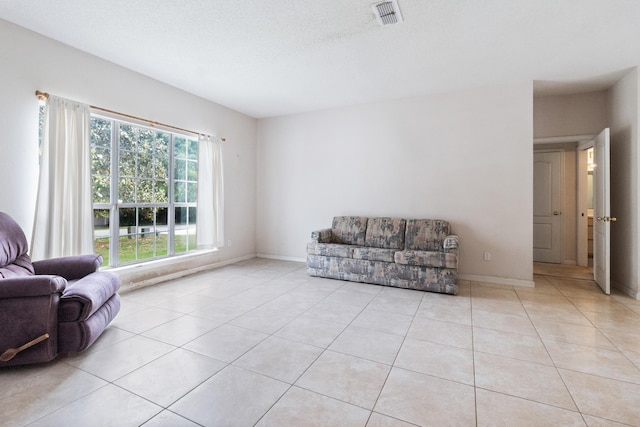 8827 Sapphire Dr, Tallahassee, FL 32309 - living area featuring light tile patterned floors and baseboards