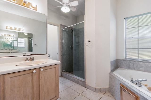 8827 Sapphire Dr, Tallahassee, FL 32309 - bathroom with tile patterned flooring, a shower stall, a bath, vanity, and a ceiling fan