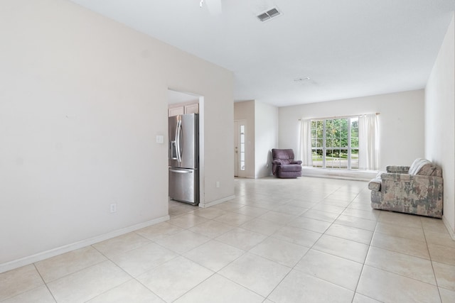 8827 Sapphire Dr, Tallahassee, FL 32309 - unfurnished living room with light tile patterned floors and baseboards