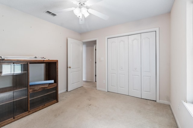 8827 Sapphire Dr, Tallahassee, FL 32309 - unfurnished bedroom with carpet flooring, baseboards, a closet, and a ceiling fan
