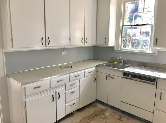 kitchen with white cabinets, sink, and dishwasher